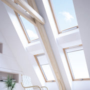 An image of a Dakea Electric Opener AMC 100 installed onto a window, showing what it looks like when closed.