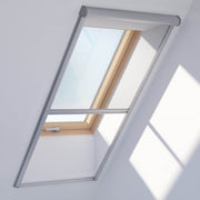 A image showing a Dakea Insect Screen for Roof Windows ZIA installed on the inside of a window.