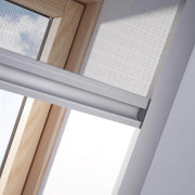 A close up image showing a Dakea Insect Screen for Roof Windows ZIA installed on the inside of a window.