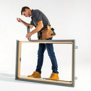 An image of a Dakea Insulation Foam Collar IFC being fitted to a wooden window frame.