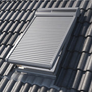 An image showing Dakea Solar Roller Shutters - SSR from the outside of a roof to show what they look like when fully closed on an open window