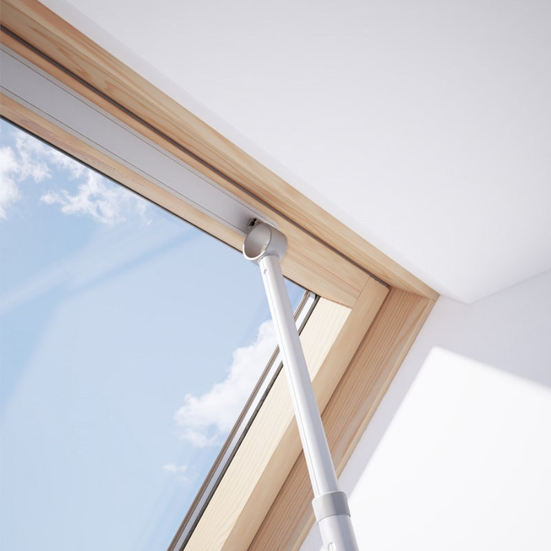 An image of a Dakea Telescopic Opening Rod ZCA being used to open a vent on a window to show how it can be used.