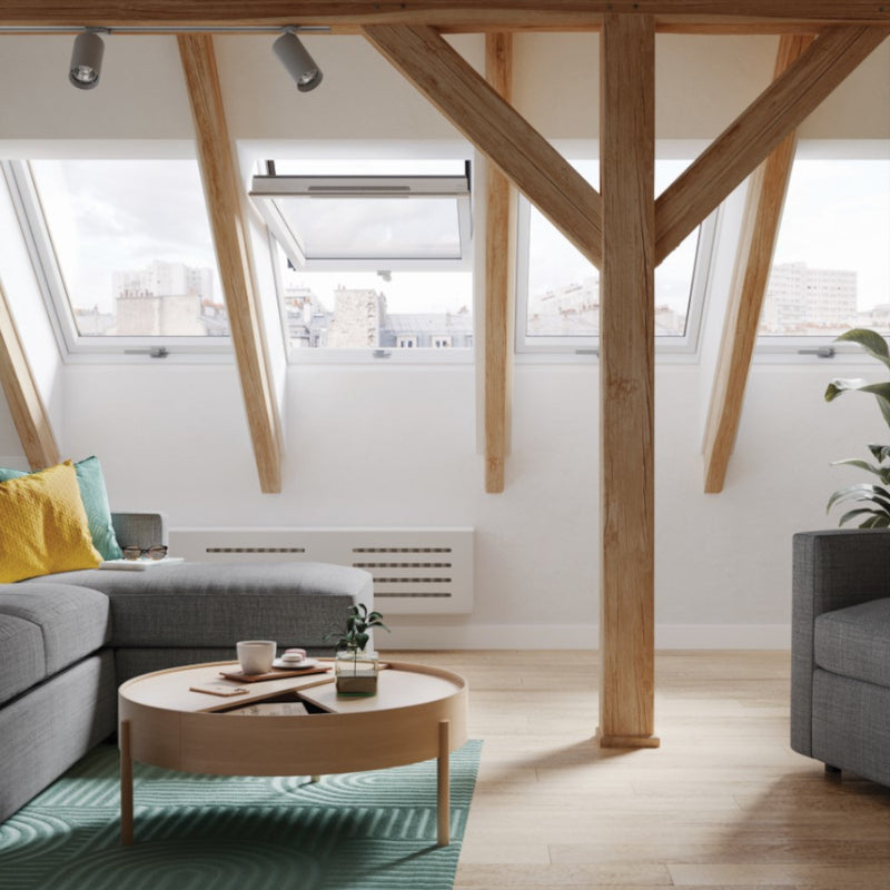 An image showing a Dakea Ultima Energy Centre Pivot Roof Window KEV-B1800 fitted into a livingroom to show how it looks