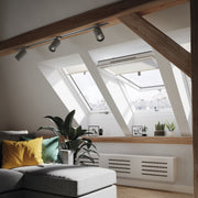 An image showing a Dakea Ultima Energy Centre Pivot Roof Window KEV-B1810 fitted into a livingroom to show how it looks