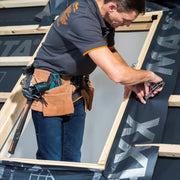 An image of Dakea Underfelt Foil Collar RUC being installed around a window.
