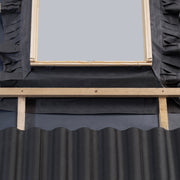 An image of Dakea Underfelt Foil Collar RCF once it has been fitted to a window.