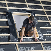 An image of Dakea Underfelt Foil Collar RUC being installed around a window.