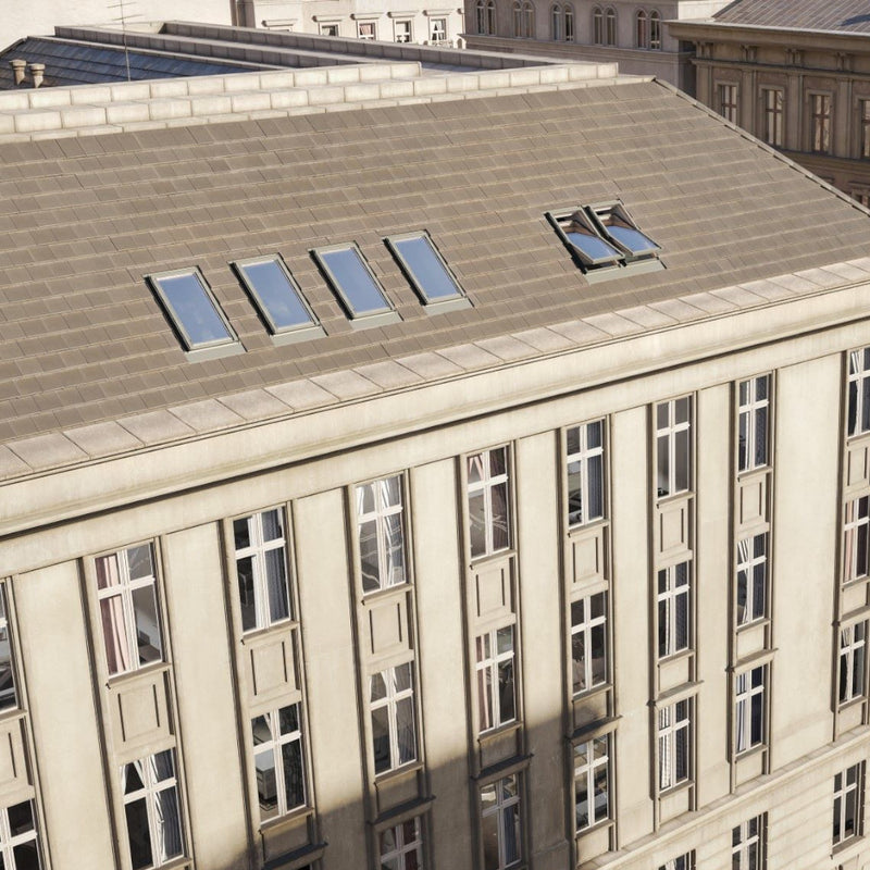 An image showing a Dakea Ultima Comfort Centre Pivot Roof Window fitted to the top of a very large building to show the versitility.