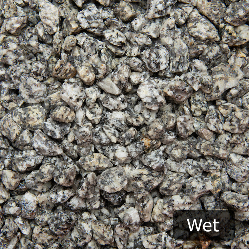 An image showing Dapple Grey Granite Stone Aggregate Chippings when they are wet.