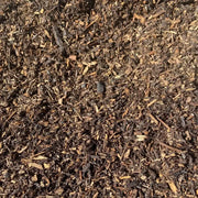 Image of landscaping bard wood mulch. They are brown tones and are supplied in a bulk bag