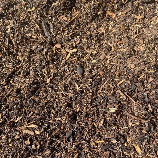 Image of landscaping bard wood mulch. They are brown tones and are supplied in a bulk bag