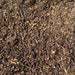 Image of landscaping bard wood mulch. They are brown tones and are supplied in a bulk bag