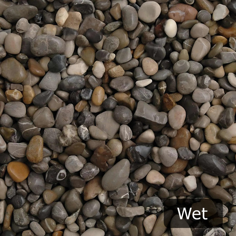 An image showing Dove Grey Pebble Stone Aggregate Gravel when they are wet.