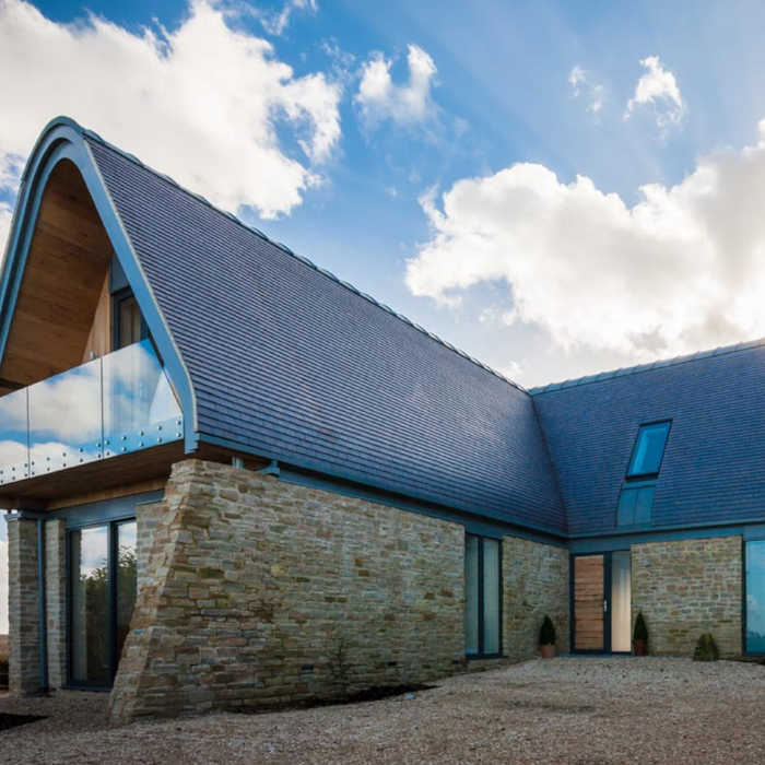 An image of a roof fitted with Dreadnought Machine Made Clay Tiles in Staffordshire Blue