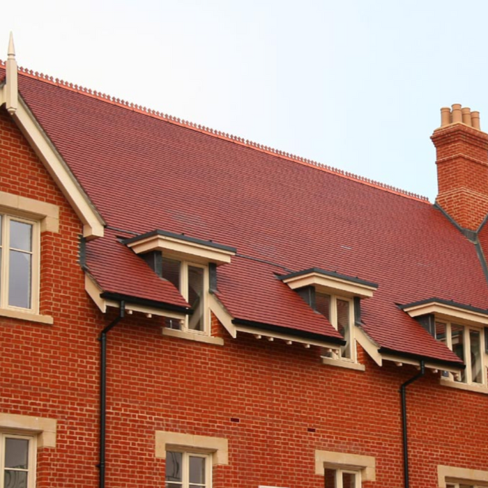 An image of a roof fitted with Dreadnought Machine Made Clay Tiles in Staffordshire Red