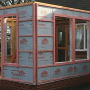 An image showing Dupont Timber Frame Membrane Tyvek Housewrap Breather Membrane on a building.