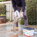 An image of easy joint paving jointing compound being poured onto a patio ready for laying.