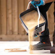 Image of Azpects EasyJoint Porcelain Next-Gen Jointing Paving Compound being poured out into some paving slabs.