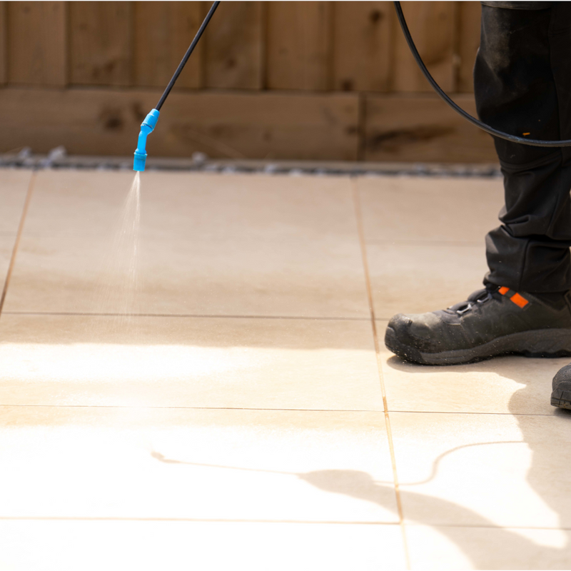 Image of Azpects EasyJoint Porcelain Next-Gen Jointing Paving Compound being sprayed lightly with water to activate the compound.
