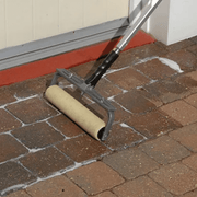 an image of EASYSeal BCS Block and Concrete Sealer being applied with a long armed roller to block paving