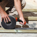 Image of an EDMA Hammer Tacker / Puncher being used to staple down felt to roof timber