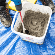 An image of EASYPrime Priming Slurry being mixed in the tub it is supplied in