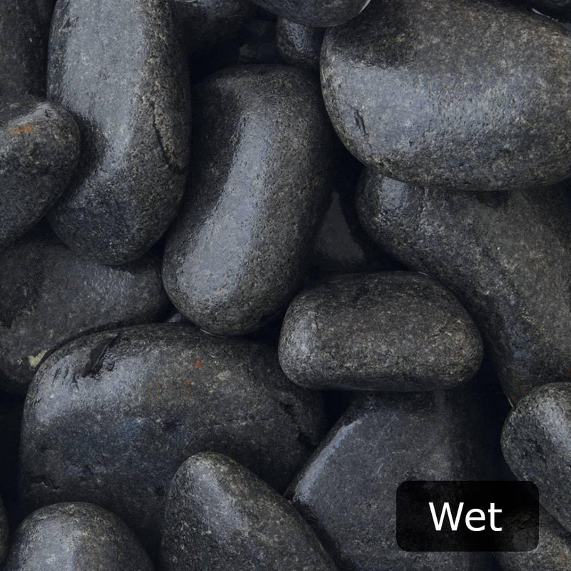 An image showing Ebony Cobble Stone Aggregate Gravel when they are wet.