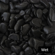 An image showing Ebony Pebble Stone Aggregate Gravel when they are wet.