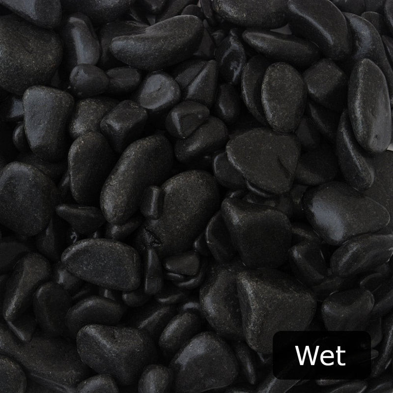 An image showing Ebony Pebble Stone Aggregate Gravel when they are wet.