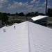 An image of a roof painted with Black Jack Solar Reflective Paint 907 to sow the finish.