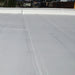 An image of a roof painted with Black Jack Solar Reflective Paint 907 to sow the finish.