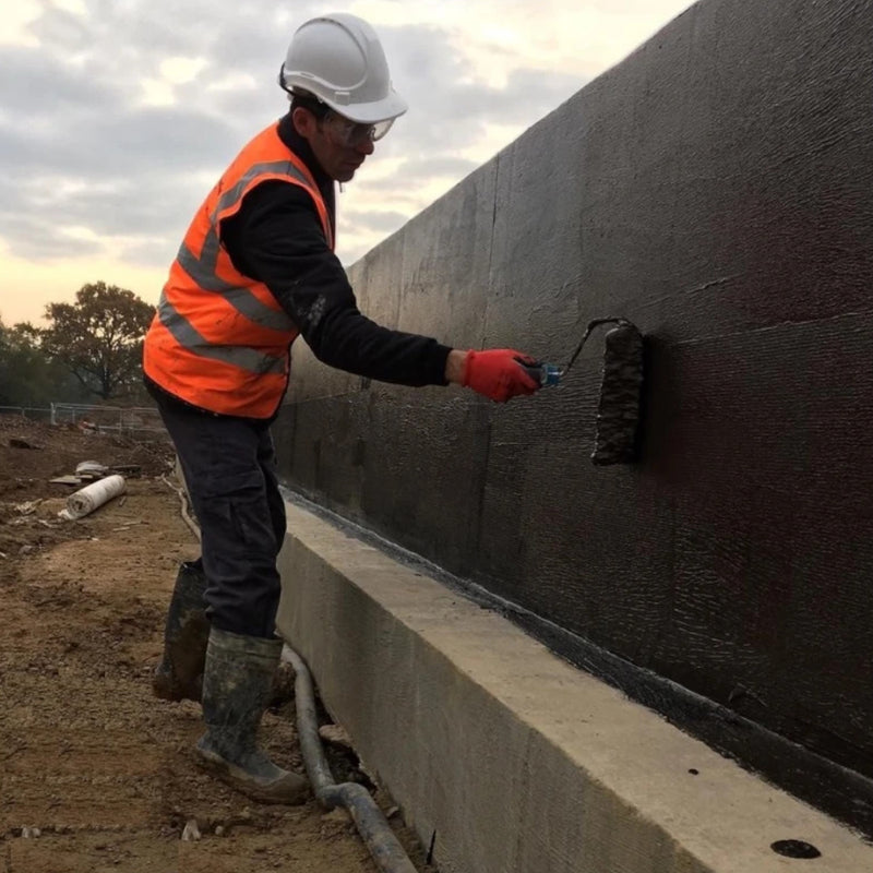 An image of Black Jack DPM 908 being applied to a wall with a roller.