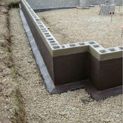 An image of Black Jack DPM 908  applied to a wall sitting on a houses foundations.