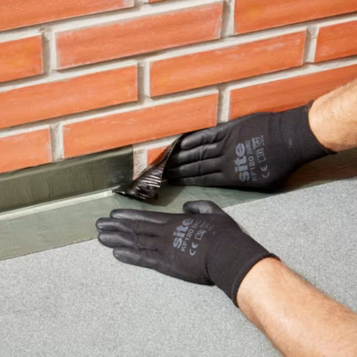 An image of Everbuild Black Jack Self Adhesive Flashing Tape  being applied to bridge the gap between a wall and surface.