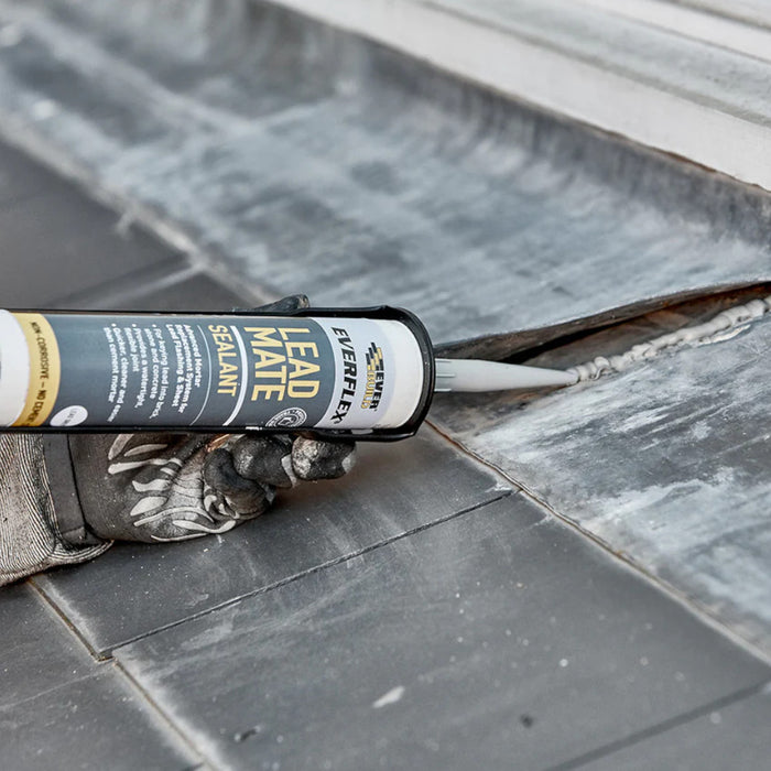 An image of Everbuild Lead mate sealant being applied between two sheets of lead flashing.