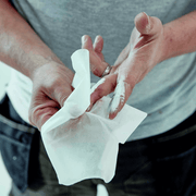 An image of someone using Everbuild Multi-Use Wonder Wipes to clean paint off of their hands.