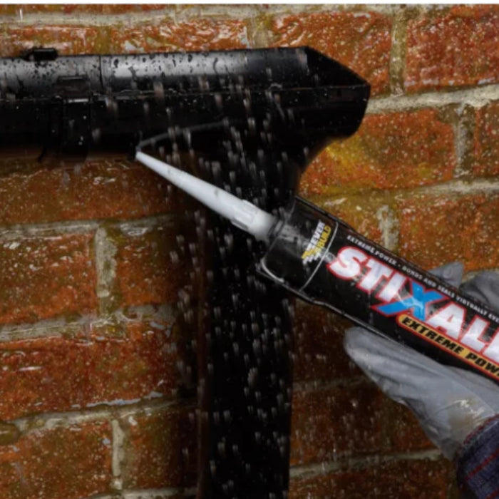 An Image of Everbuild Stixall Extreme Power being used to fix and seal a gutter in the rain so show it can be used when wet