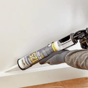 An image of Everbuild Everflex one hour Caulk 125 C3 being used to seal kick boards / Skirting boards.