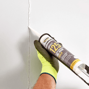 An image of Everbuild Everflex one hour Caulk 125 C3 being used to fill and cover a crack in a wall.