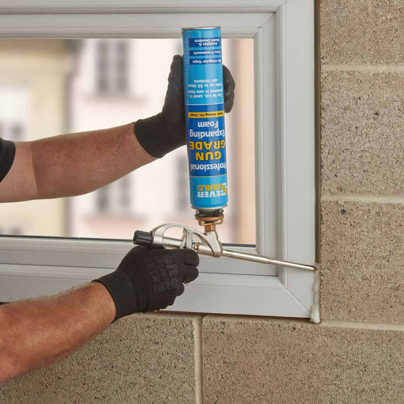 An image of Everbuild Professional Gun Grade Expanding Foam being sprayed around a window frame.