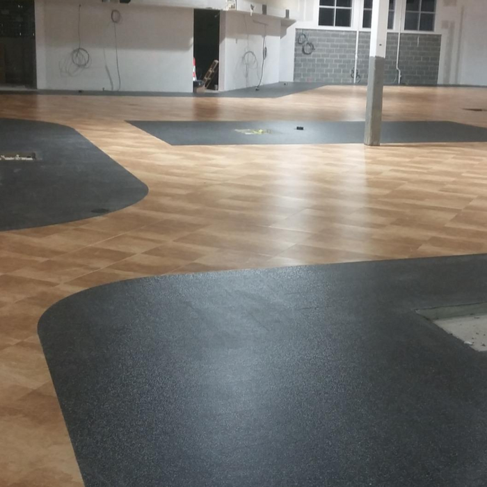 An image showing EPDM rubber applied to a floor that has been rolled and smoothed out with an Everhard Steel Seam Roller