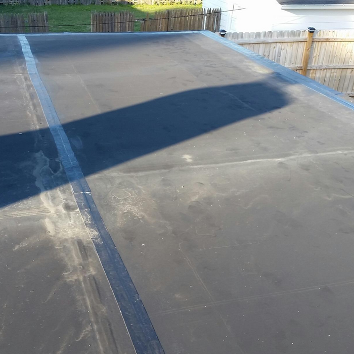 An image showing an EPDM rubber roof that has been rolled and sealed with an Everhard Steel Seam Roller