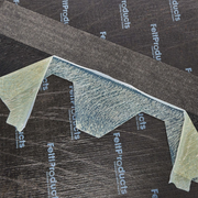 An image of a Felt Products Hexagonal Shingles Hexagonal showing the back with the adhesive strip.