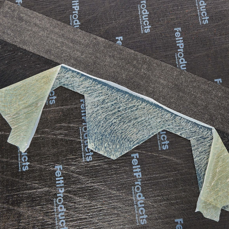 An image of a Felt Products Hexagonal Shingles Hexagonal showing the back with the adhesive strip.