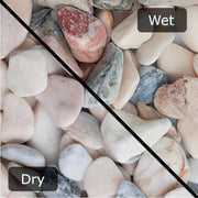 An image of Flamingo Pebble stones with a diagonal split down showing them wet and dry