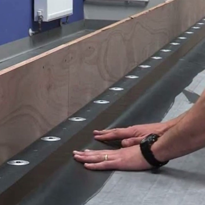 An image of Flexiproof Pressure Sensitive RUSS Strip being fitted and smoothed down.