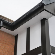 An image of a FreeFoam Freeflow Soffit Board in White mounted on the eaves of a roof to show what it looks like.