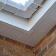 An image of FreeFoam Freeflow Soffit Joint H Trim in White fitted to the eaves on a roof to show what it looks like