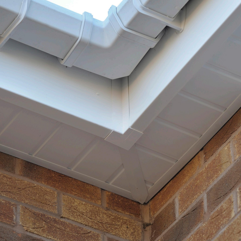 An image of FreeFoam Freeflow Soffit Joint H Trim in White fitted to the eaves on a roof to show what it looks like
