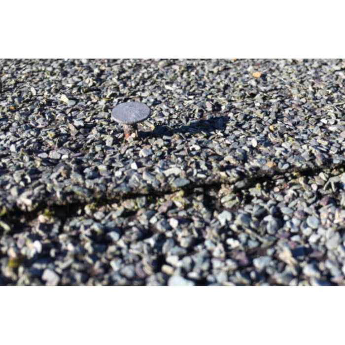 An image of a Galvanised Felt Clout Nail in 13mm being used to tac down two layers of overlapping shed felt.